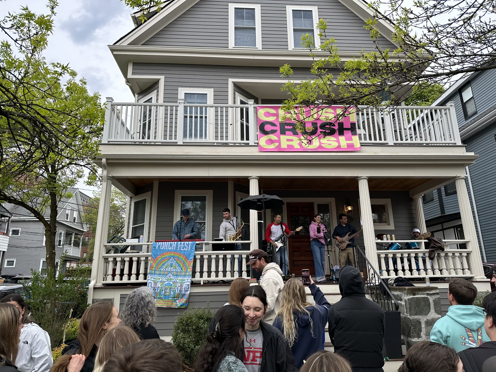 CRUSH playing on a Somerville porch with a crowd out front