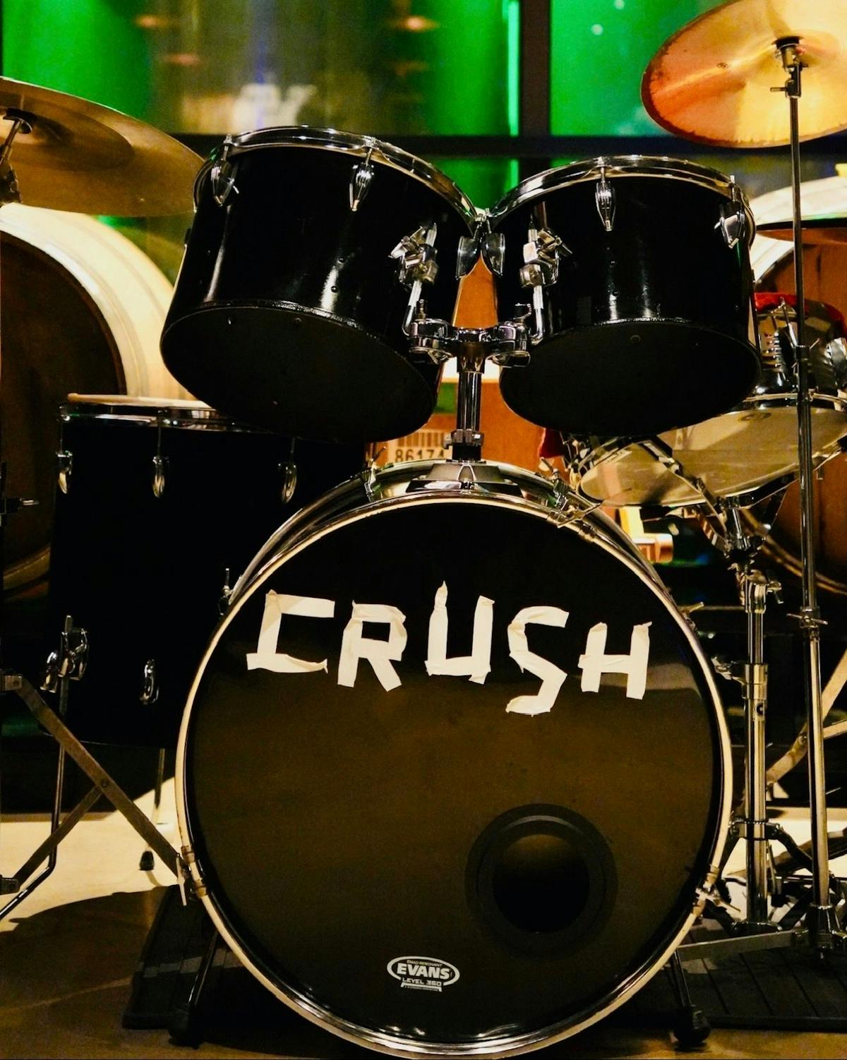 CRUSH's drum kit with the band name taped across the bass drum